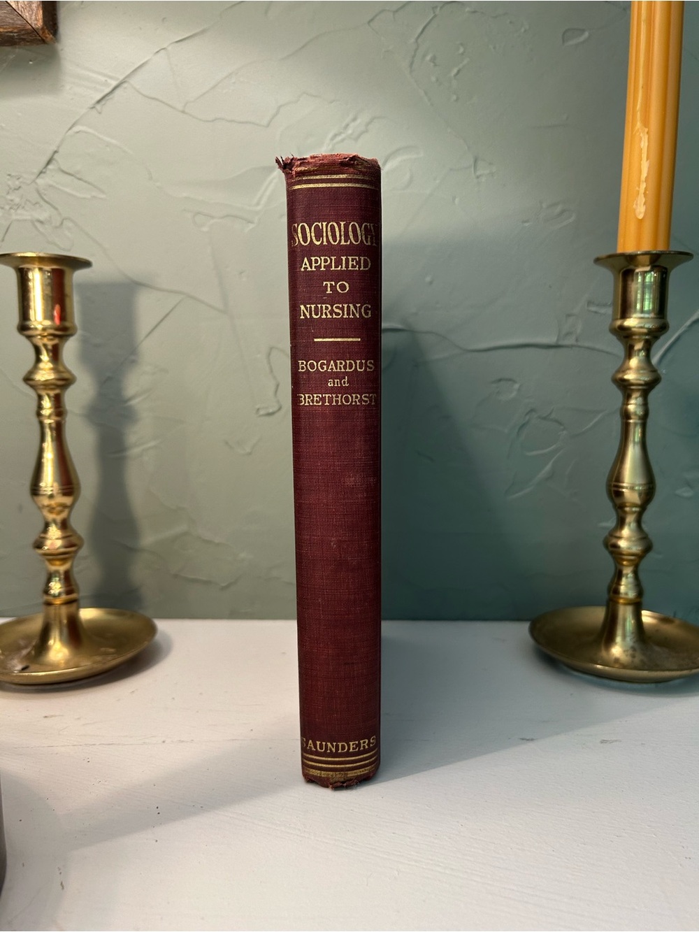 Maroon Decorative Vintage Book Accent -  “ sociology applied to nursing”